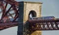 An LNER train crossing the Forth Bridge in Edinburgh, Scotland.