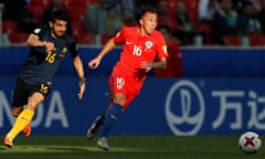 Aziz Behich chases Martin Rodriguez.