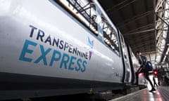 A person boarding a TransPennine Express train