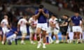 Danny Toala reacts at the final whistle as Japan players celebrate.