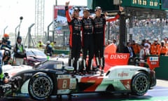 Sébastien Buemi, Ryo Hirakawa and Brendon Hartley celebrate after winning the Le Mans 24 Hours in the Toyota No 8 GR010