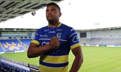 Luther Burrell, who played 15 Tests for England at rugby union, tries on his Warrington shirt for size. 