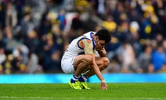 Lindsay Thomas holds his mouth after a game