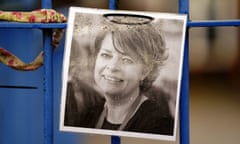 A black and white picture of Ruth Perry attached to a fence