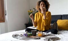 Woman eating in bed