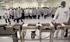 A worker monitors chocolate bars at the French manufacturers CEMOI factory in Abidjan on 18 May 2015.