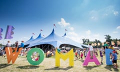 Revellers enjoy the glorious sunshine at WOMAD festival 2014, in Wiltshire, as temperatures reach into the high twenties. July 25 2014.