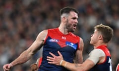 Joel Smith of the Demons (left) celebrates with team mates after kicking a goal during the AFL Semi-final between the Melbourne Demons and Carlton Blues at the MCG in Melbourne, Friday, September 15, 2023. (AAP Image/James Ross) NO ARCHIVING, EDITORIAL USE ONLY