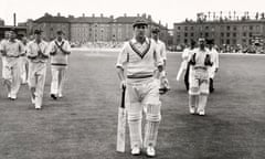 Len Hutton, playing for Yorkshire (foreground), is applauded by his opponents, the Surrey Cricket Club, after scoring his 100th century at the Kennington Oval in London, circa August 1951.