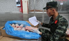 Police in Guangdong province, China, inspect pig meat transported from high-risk areas of African swine fever.