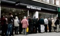 Customers queue to enter a branch of Northern Rock