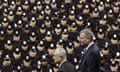 FILE - In this Dec. 29, 2014 file photo, New York City Mayor Bill de Blasio, right, and NYPD police commissioner Bill Bratton, center, stand on stage during a New York Police Academy graduation ceremony at Madison Square Garden in New York. Mayor de Blasio has spent much of the week answering questions about a 9 percent spike in crime in New York. But experts say that a major rise in crime, which hasn't happened yet during his administration, would be more damaging to him than other mayors since he had a reputation for being soft on crime, his relationship with the police is tenuous and so much of his plan to change the justice system is hinged on the idea that crime will not rise. (AP Photo/John Minchillo, File)