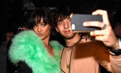 Rihanna takes a selfie with a fan at the 2016 Billboard music awards.