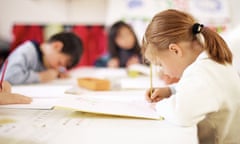 Children sitting at table, writing<br>AWRY36 Children sitting at table, writing