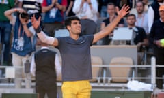 Carlos Alcaraz celebrates after coming from behind to beat Jannik Sinner in their French Open semi-final.