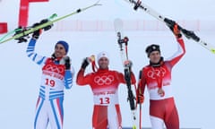 Gold medallist Beat Feuz (C), silver medallist Johan Clarey of France (L) and bronze medalist Matthias Mayer of Austria (R).