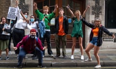 A level students celebrate outside the Department for Education in London after it was confirmed that candidates in England will be given grades estimated by their teachers, rather than by an algorithm.