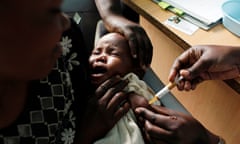 A mother holds her baby as she receives a new malaria vaccine as part of a trial at the Walter Reed Project Research Center in Kombewa in Western Kenya, October 30, 2009. In a statement published on Friday, July 24, 2015, the European Medicines Agency is recommending that the worlds leading malaria vaccine be licensed even though it is only about 30 percent effective and that protection fades over time. The vaccine, known as Mosquirix and made by GlaxoSmithKline, protects only about one-third of children though it might help protect some kids from getting the parasitic disease. 