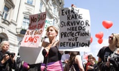 A demonstrator calling for reform of the law around rape.