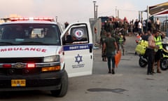 Soldiers, emergency services and civilians at the site where a playground in Majdal Shams