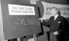 Prime Minister Harold Macmillan writing the number of the draw.