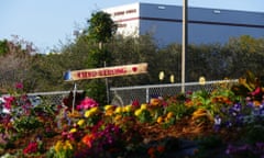 Flowers and a sign saying 'MSD Strong' in front of a box-like school building.