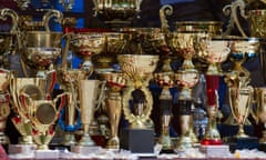 Lots of polished trophies on a table