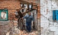 Ivan Mishchenko inside his farmhouse destroyed by bombing