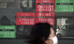 An electronic stock board showing Japan’s Nikkei 225 index at a securities firm in Tokyo today