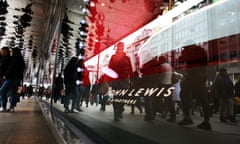 Shoppers pass a John Lewis on Oxford Street