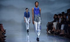 Models present spring/summer 2024 creations by Giorgio Armani during Milan fashion week.
