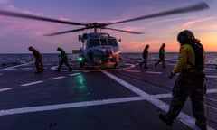In this undated photo provided by the Australian Defence Force, a Seahawk helicopter prepares to take off from the deck of HMAS Hobart during flying operations while on a regional presence deployment off northern Australia. Australia has protested to Beijing through multiple channels that a Chinese fighter jet endangered an Australian navy helicopter with flares over international waters, the prime minister said Tuesday, May 7, 2024. (LSIS Matthew Lyall/Australian Defence Force via AP)