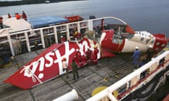 The tail section of crashed AirAsia Flight 8501 on a recovery ship in Borneo, Indonesia.