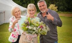 Nancy Birtwhistle, centre, the 2014 champion of the Great British Bake Off, with judges  Mary Berry and Paul Hollywood.