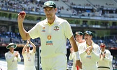 Australia's Scott Boland departs with the match ball after his dream debut.