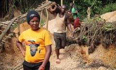 Minerals: Bertha Bangala, 36, stands in front of the washing station where the men she employs have been cleaning the mineral sand they dug in the mining pit she owns. Bangala is one of the "mères bosses" that have started their own business in Kailo following ASEFA's training. feminist activist Annie Sinanduku Mwange who is fighting for women's empowerment in the artisanal mining sector