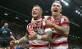 Wigan Warriors’ Josh Charnley (left) celebrates his try against Warrington Wolves with Sam Powell.