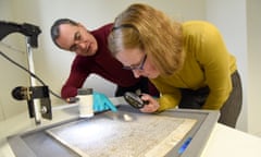 Chris Woods, left, and Emily Naish work on the Magna Carta at a secret location near Salisbury.