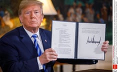 President Trump holds the declaration confirming the US withdrawal from the Iran nuclear deal