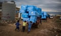 Kids push aid truck in Iraq