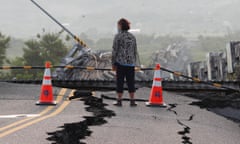 Person looking out over damaged road after an earthquake in Taiwan