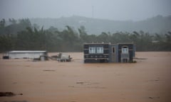 A flooded house in an expanse of water in Cayey, Puerto Rico