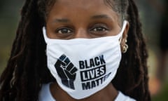 A protester at Town Field Park in the Dorchester neighborhood of Boston, on Friday.