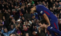 Lionel Messi (below) celebrates scoring Barcelona’s winner with Luis Suárez.