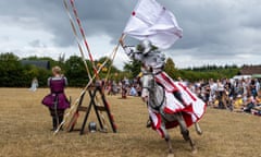 An armoured knight thrills the crowds at a medieval jousting tournament at Chiltern Open Air Museum