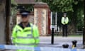 Police guard an entrance to Forbury Gardens  in Readin