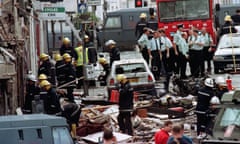 Police officers and firefighters inspecting the damage after the 15 August 1998 bombing