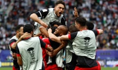 Jordan's players celebrate their win over Iraq in Doha