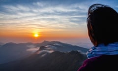 woman looking at sunset