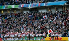 Japan players bow in front of the crowd